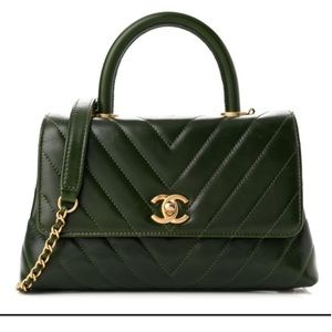 Authentic CHANEL Calfskin Chevron Quilted Mini Coco Handle Flap in green.